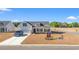 New construction home with two-car garage and landscaped yard at 197 Six Mile Creek Dr., Georgetown, SC 29440