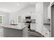 Modern kitchen with island, granite countertops, and stainless steel appliances at 197 Six Mile Creek Dr., Georgetown, SC 29440