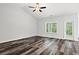 Bright and airy living room with large windows and hardwood flooring at 197 Six Mile Creek Dr., Georgetown, SC 29440