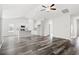 Open living room with high ceilings, hardwood floors, and a view of the kitchen at 197 Six Mile Creek Dr., Georgetown, SC 29440