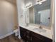 Bathroom offers a double sink vanity with modern fixtures, a framed mirror, and a walk-in shower at 2770 Daisy Rd., Loris, SC 29569