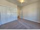 Clean bedroom with plush carpet, closet, and soft, natural light creating a serene space at 2770 Daisy Rd., Loris, SC 29569