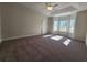 Expansive bedroom boasts tray ceilings, a ceiling fan, and bright windows that allow ample sunlight at 2770 Daisy Rd., Loris, SC 29569