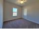 Clean bedroom with plush carpet, closet, and large window offering lots of natural light at 2770 Daisy Rd., Loris, SC 29569