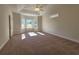 Large bedroom featuring a ceiling fan, tray ceiling and sunny windows that bring in natural light at 2770 Daisy Rd., Loris, SC 29569