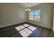 Sunlit dining room features a modern chandelier and a large window that offers natural light and outdoor views at 2770 Daisy Rd., Loris, SC 29569