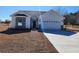 Charming single-story home featuring a classic design, attached garage, and well-manicured front lawn at 2770 Daisy Rd., Loris, SC 29569