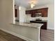 Modern kitchen featuring granite countertops, stainless steel appliances, and stylish pendant lighting above a breakfast bar at 2770 Daisy Rd., Loris, SC 29569