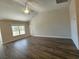 Bright living room boasting high ceilings, wood floors, and a large window offering natural light at 2770 Daisy Rd., Loris, SC 29569