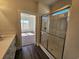 Bathroom featuring a large shower and adjacent bedroom visible through an open doorway at 2808 Daisy Rd., Loris, SC 29569