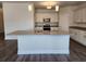 Open kitchen boasts white cabinets, stainless appliances, granite countertops, and a large island at 2808 Daisy Rd., Loris, SC 29569