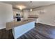 Kitchen with white cabinets, stainless appliances, a granite countertop island, and hardwood floors at 2808 Daisy Rd., Loris, SC 29569