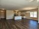 Bright open concept living space features recessed lights, an island, and luxury vinyl plank flooring at 2808 Daisy Rd., Loris, SC 29569