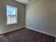 Bright bedroom with plush carpet, a ceiling fan, and a window view of the outdoors at 2814 Daisy Rd., Loris, SC 29569