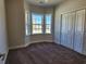 Cozy bedroom featuring a bay window, a double door closet, and plush carpeting at 2814 Daisy Rd., Loris, SC 29569