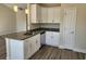Well-equipped kitchen featuring white cabinets, granite countertops, and stainless steel appliances at 2814 Daisy Rd., Loris, SC 29569