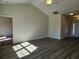 Spacious living area with wood floors, vaulted ceilings, and an open layout, and a view to the foyer at 2814 Daisy Rd., Loris, SC 29569