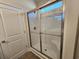 Bathroom with a shower featuring glass doors and chrome fixtures at 2814 Daisy Rd., Loris, SC 29569