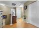 A hallway with neutral walls, white trim, hardwood floors, and a closet at 4708 Caryle Ct., Myrtle Beach, SC 29579