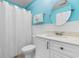 Bathroom with white vanity, toilet, and shower at 597 Blue River Ct. # 2F, Myrtle Beach, SC 29579