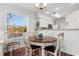 Bright dining room with table and chairs, offering a view of a lake at 597 Blue River Ct. # 2F, Myrtle Beach, SC 29579