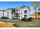 Two-story condo building with water views and palm trees at 597 Blue River Ct. # 2F, Myrtle Beach, SC 29579