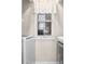 Well-lit laundry room, featuring washer, dryer, and window at 597 Blue River Ct. # 2F, Myrtle Beach, SC 29579