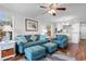 Relaxing living room featuring comfy teal sofas and coastal decor at 597 Blue River Ct. # 2F, Myrtle Beach, SC 29579