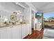 Living room with white cabinets and view to balcony at 597 Blue River Ct. # 2F, Myrtle Beach, SC 29579
