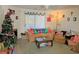 Cozy living room with comfortable furniture, a Christmas tree, and natural light from sliding glass door at 100 G Myrtle Greens Dr. # G, Conway, SC 29526