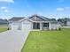 Charming single-story home with a two-car garage, well-maintained lawn, and inviting curb appeal at 1044 Kinness Dr., Conway, SC 29527