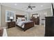 Cozy bedroom with a queen-size bed and ensuite bathroom at 158 Knotty Pine Way, Murrells Inlet, SC 29576