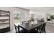 Dining area with black table and chairs, and view of backyard at 189 Ashworth Dr., Tabor City, NC 28463