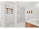 Clean bathroom features marble floors, updated tile shower, and wood shelf at 2053 Haystack Way, Myrtle Beach, SC 29579