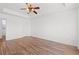 Empty bedroom shows tray ceiling with a ceiling fan and hardwood flooring at 2053 Haystack Way, Myrtle Beach, SC 29579