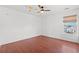 Bright bedroom with cherry wood flooring, ceiling fan, and natural light at 2053 Haystack Way, Myrtle Beach, SC 29579
