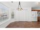 Cozy breakfast nook with bright windows, modern lighting, with a pantry and warm wood-look flooring at 2053 Haystack Way, Myrtle Beach, SC 29579
