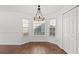 Cozy breakfast nook with bright windows, modern lighting, and warm wood-look flooring at 2053 Haystack Way, Myrtle Beach, SC 29579