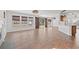 Open concept living room with modern lighting, a sliding barn door, and expansive windows at 2053 Haystack Way, Myrtle Beach, SC 29579