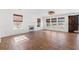 Spacious living room featuring a fireplace, wood-look tile floors, and multiple windows at 2053 Haystack Way, Myrtle Beach, SC 29579