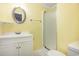 Simple bathroom with shower and white vanity at 2405 S Ocean Blvd. # 207, North Myrtle Beach, SC 29582