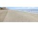 Expansive beachfront view with ocean waves and sandy shoreline at 2405 S Ocean Blvd. # 207, North Myrtle Beach, SC 29582