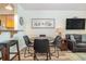 Small dining area with four chairs and kitchen access at 2405 S Ocean Blvd. # 207, North Myrtle Beach, SC 29582