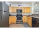 Bright kitchen with stainless steel appliances and light wood cabinets at 2405 S Ocean Blvd. # 207, North Myrtle Beach, SC 29582
