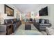 Spacious living area with comfortable seating and large TV at 2405 S Ocean Blvd. # 207, North Myrtle Beach, SC 29582