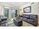 Living room with ocean view balcony access at 2405 S Ocean Blvd. # 207, North Myrtle Beach, SC 29582