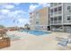Community pool and surrounding lounge area at 2405 S Ocean Blvd. # 207, North Myrtle Beach, SC 29582