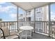 Relaxing screened balcony overlooking the pool and ocean at 2405 S Ocean Blvd. # 207, North Myrtle Beach, SC 29582