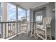Spacious screened balcony with outdoor seating at 2405 S Ocean Blvd. # 207, North Myrtle Beach, SC 29582