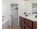 Double vanity bathroom with dark wood cabinets and a garden tub at 255 Sea Turtle Dr., Myrtle Beach, SC 29588